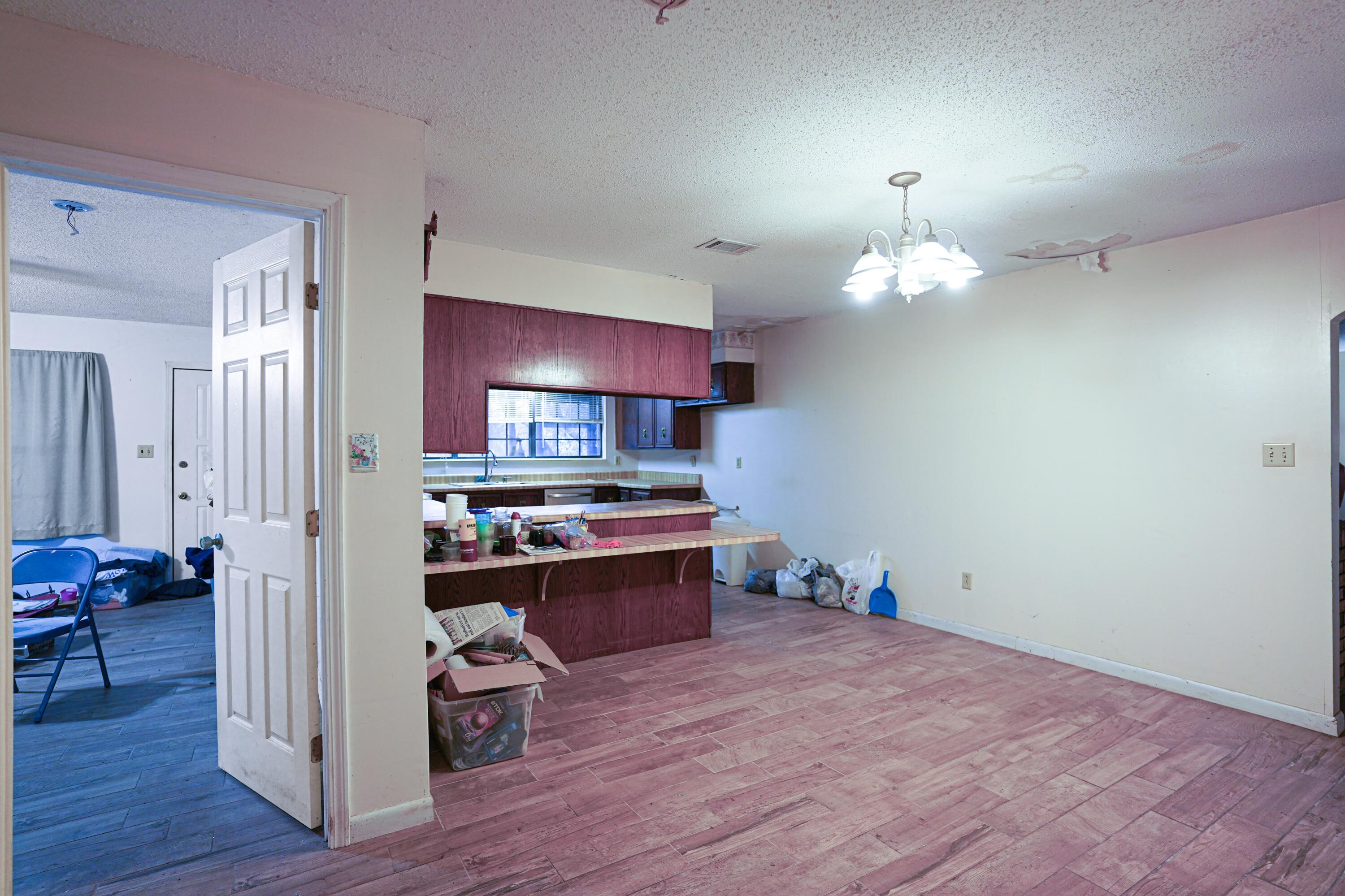 4444 Sundance Way Holt, FL 32564 - Photo 20 of 39 a view of kitchen and sink with wooden floor