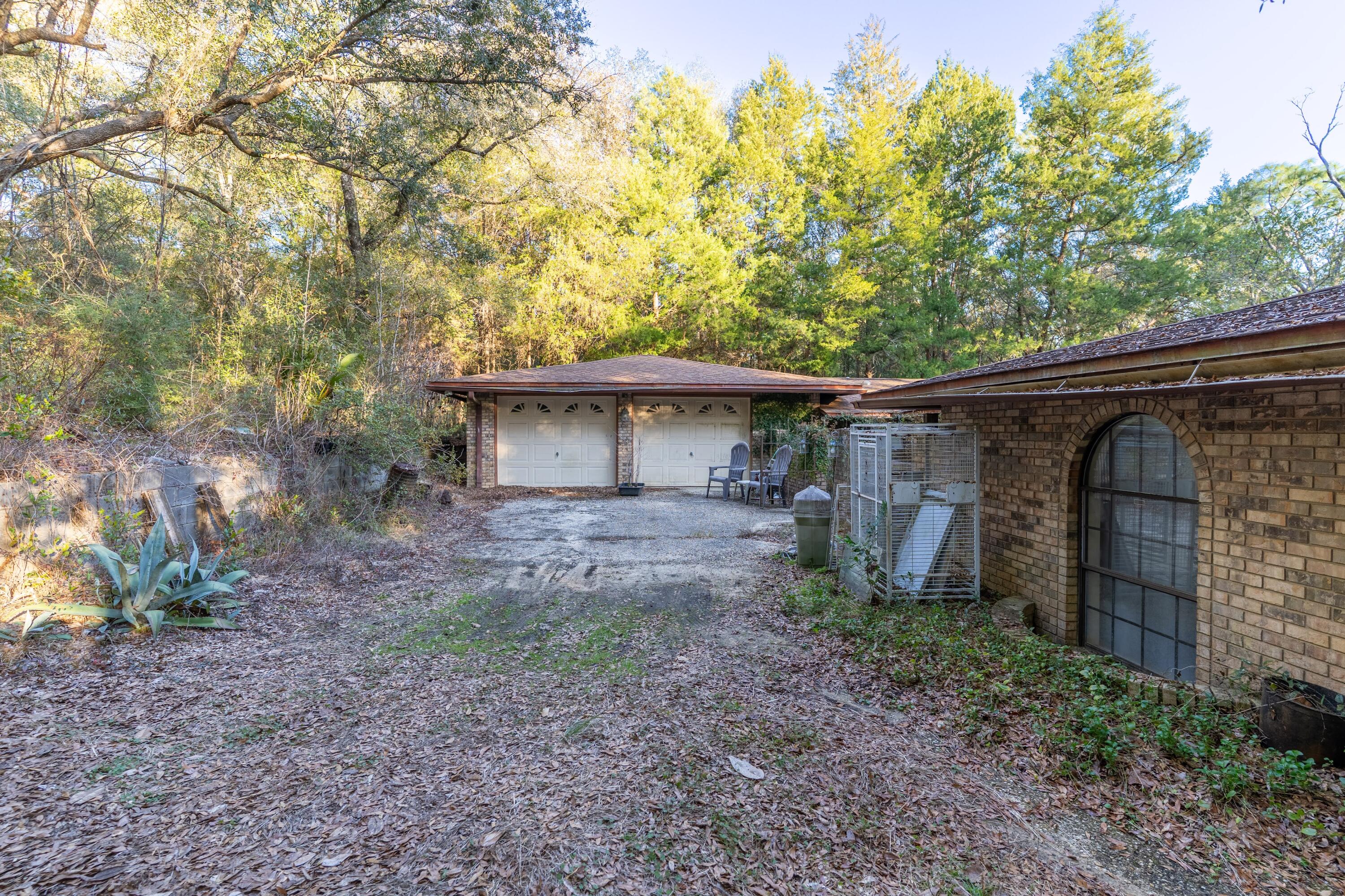 4444 Sundance Way Holt, FL 32564 - Photo 2 of 39 a view of a house with a backyard