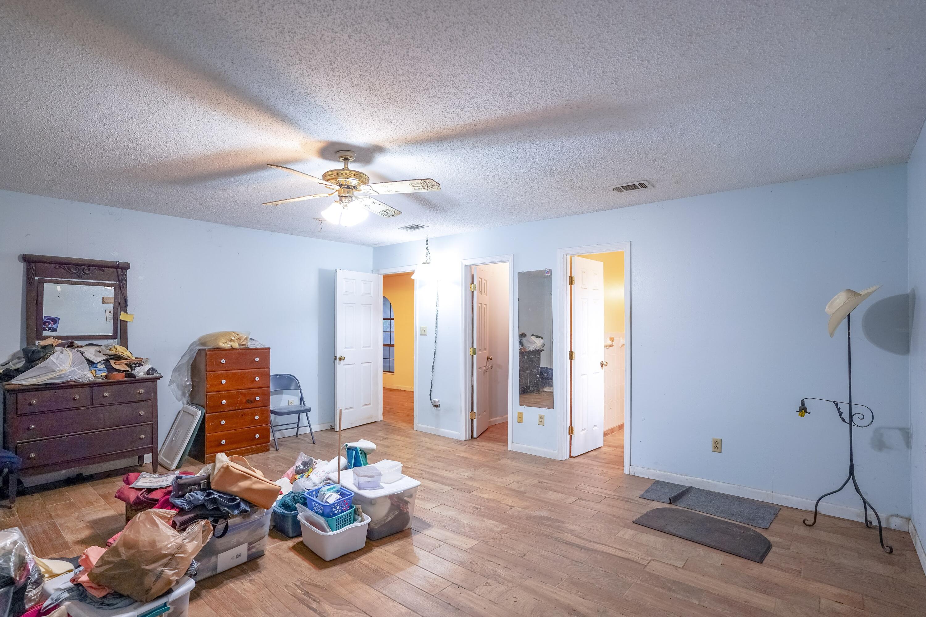4444 Sundance Way Holt, FL 32564 - Photo 23 of 39 a living room with furniture and a chandelier