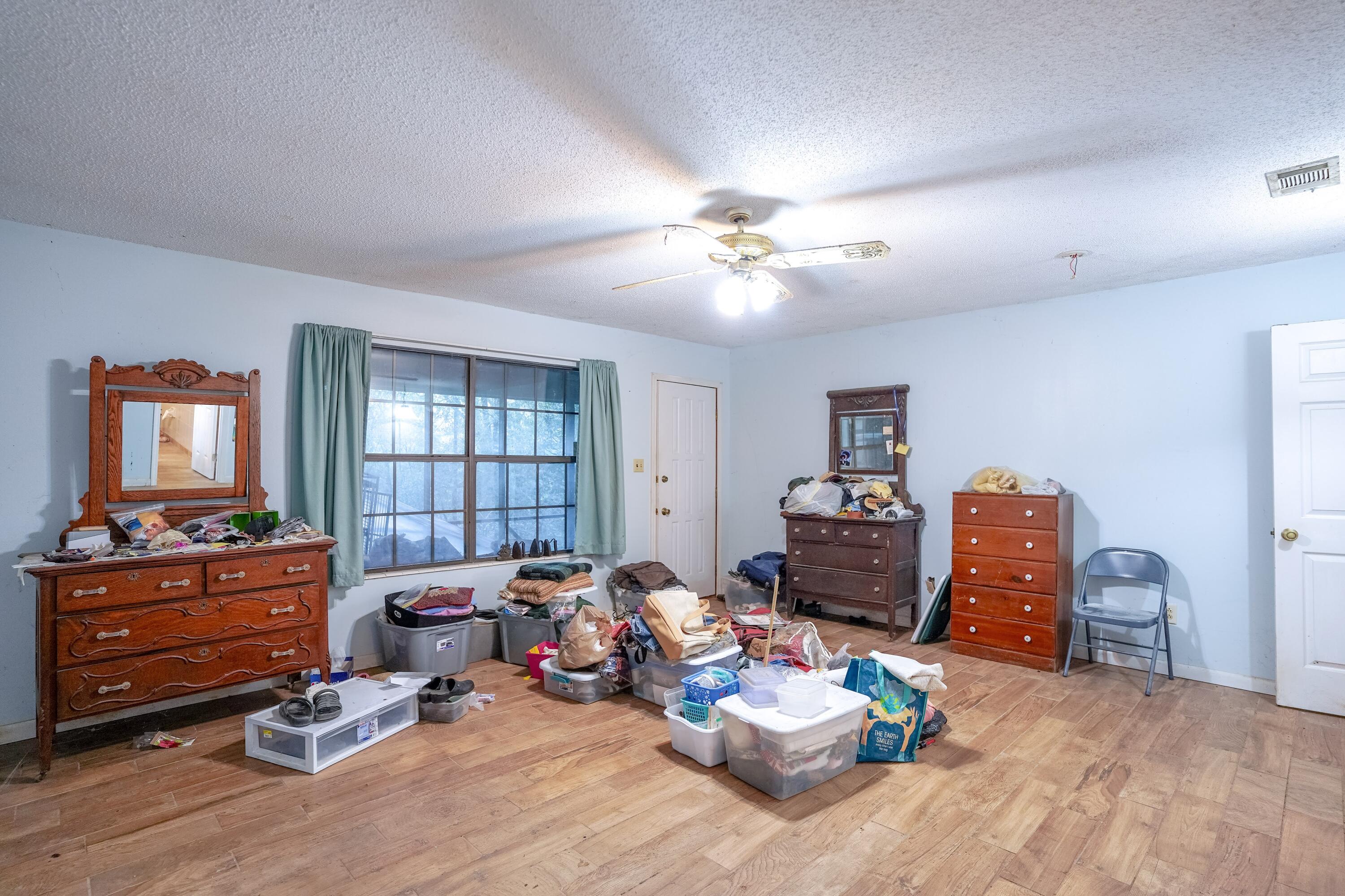 4444 Sundance Way Holt, FL 32564 - Photo 24 of 39 a bedroom with furniture and a window