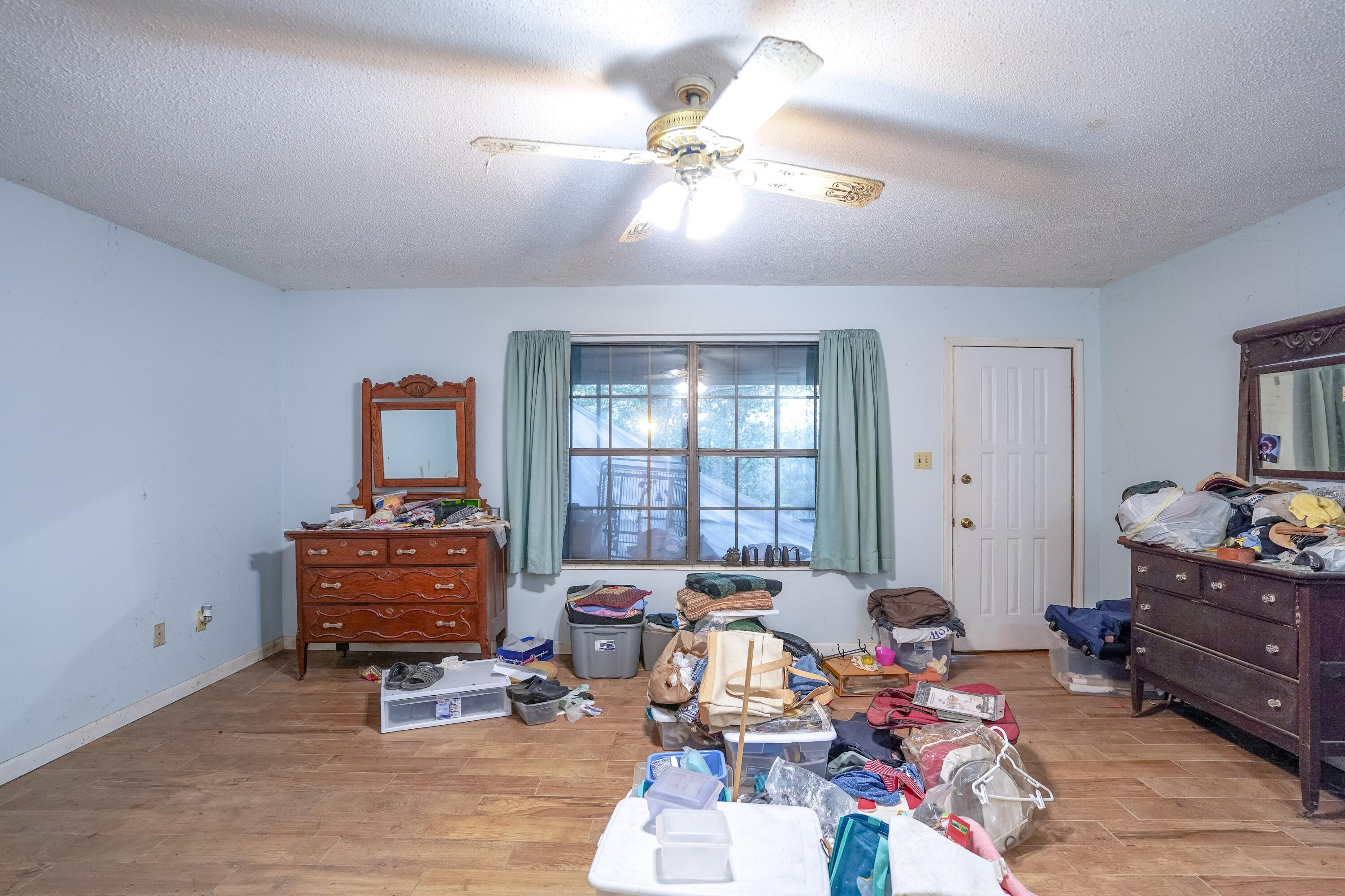 4444 Sundance Way Holt, FL 32564 - Photo 25 of 39 a living room with furniture and a chandelier