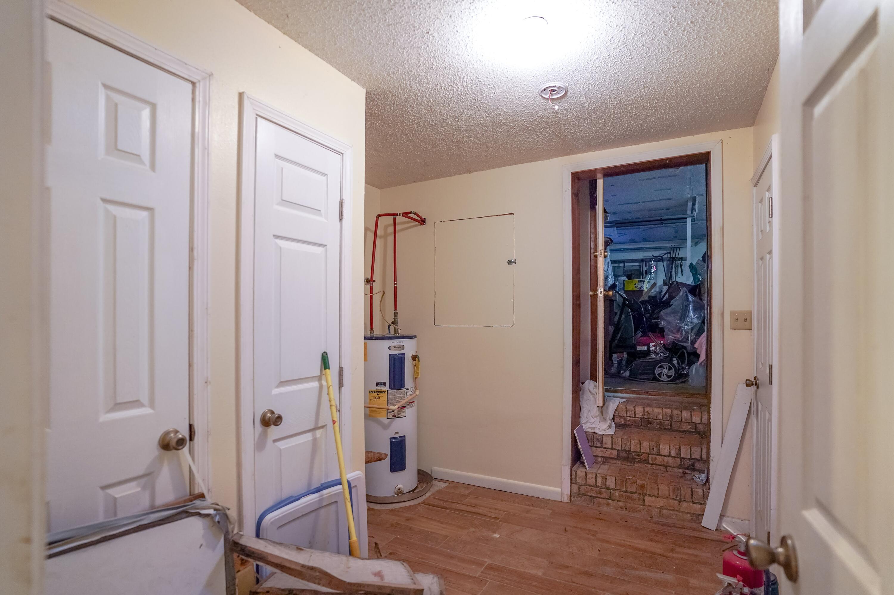 4444 Sundance Way Holt, FL 32564 - Photo 29 of 39 a view of room with wooden floor and bathroom