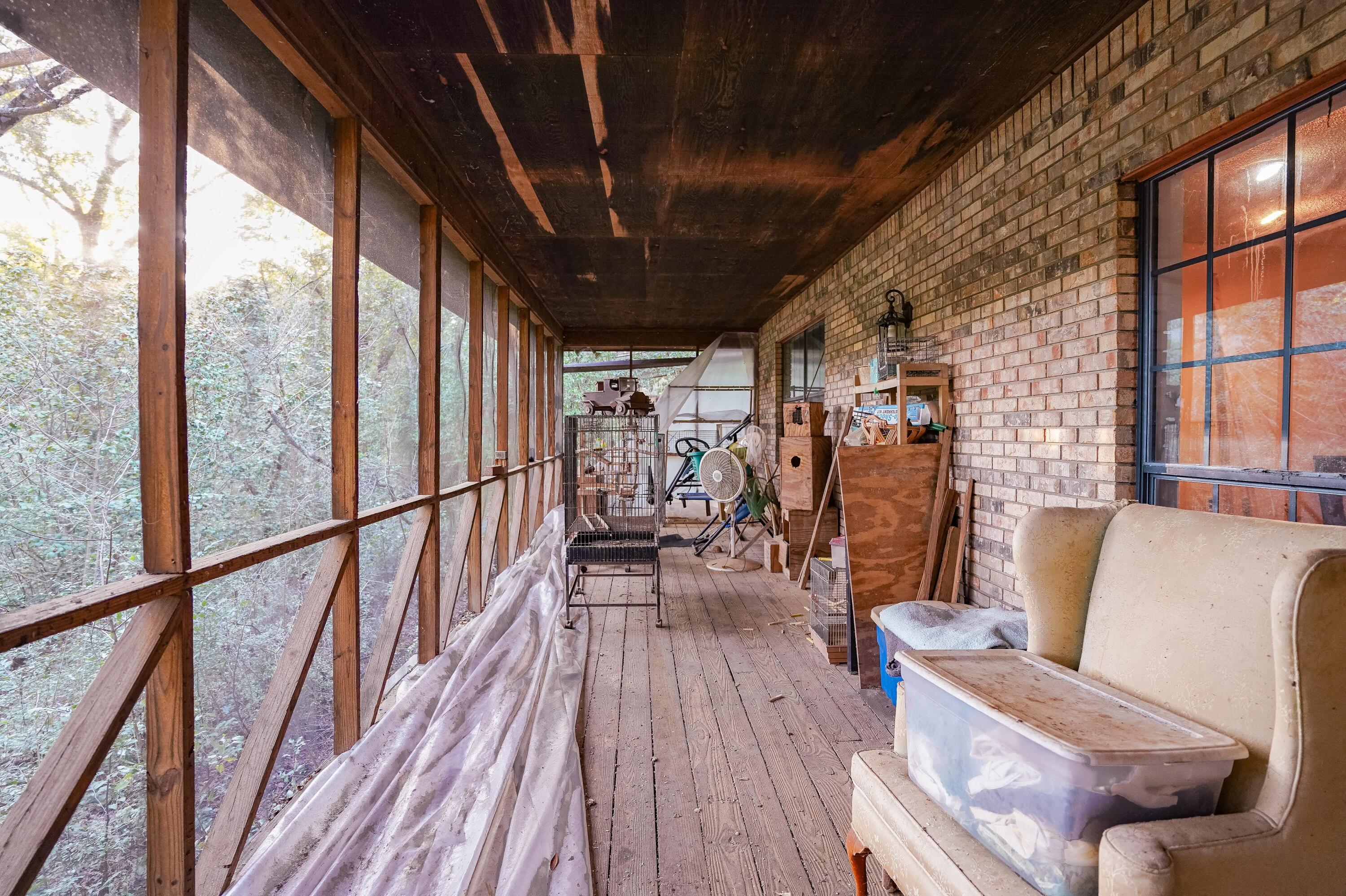 4444 Sundance Way Holt, FL 32564 - Photo 9 of 39 a view of a living room with furniture and wooden floor