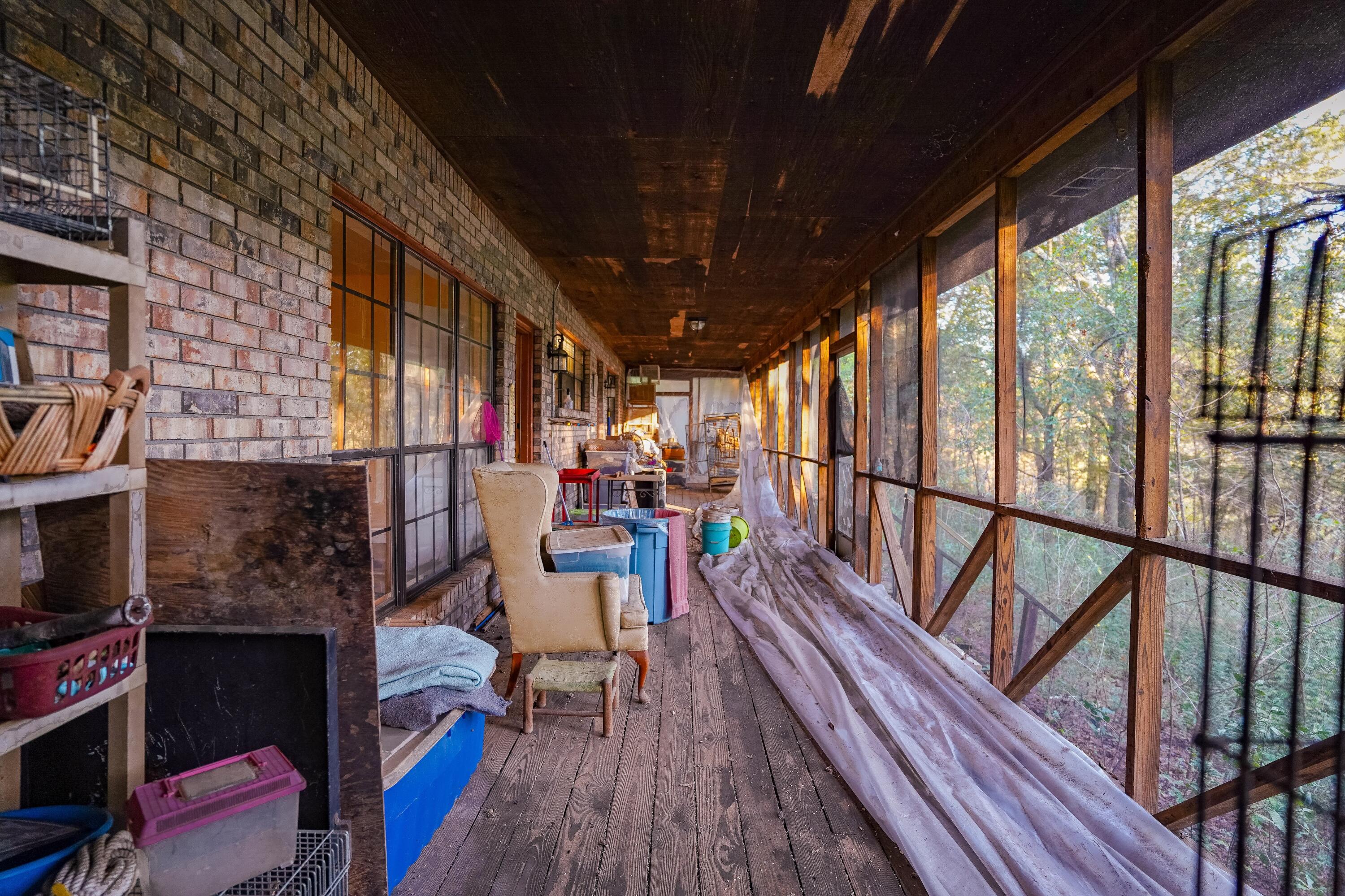 4444 Sundance Way Holt, FL 32564 - Photo 10 of 39 a view of chairs in wooden deck
