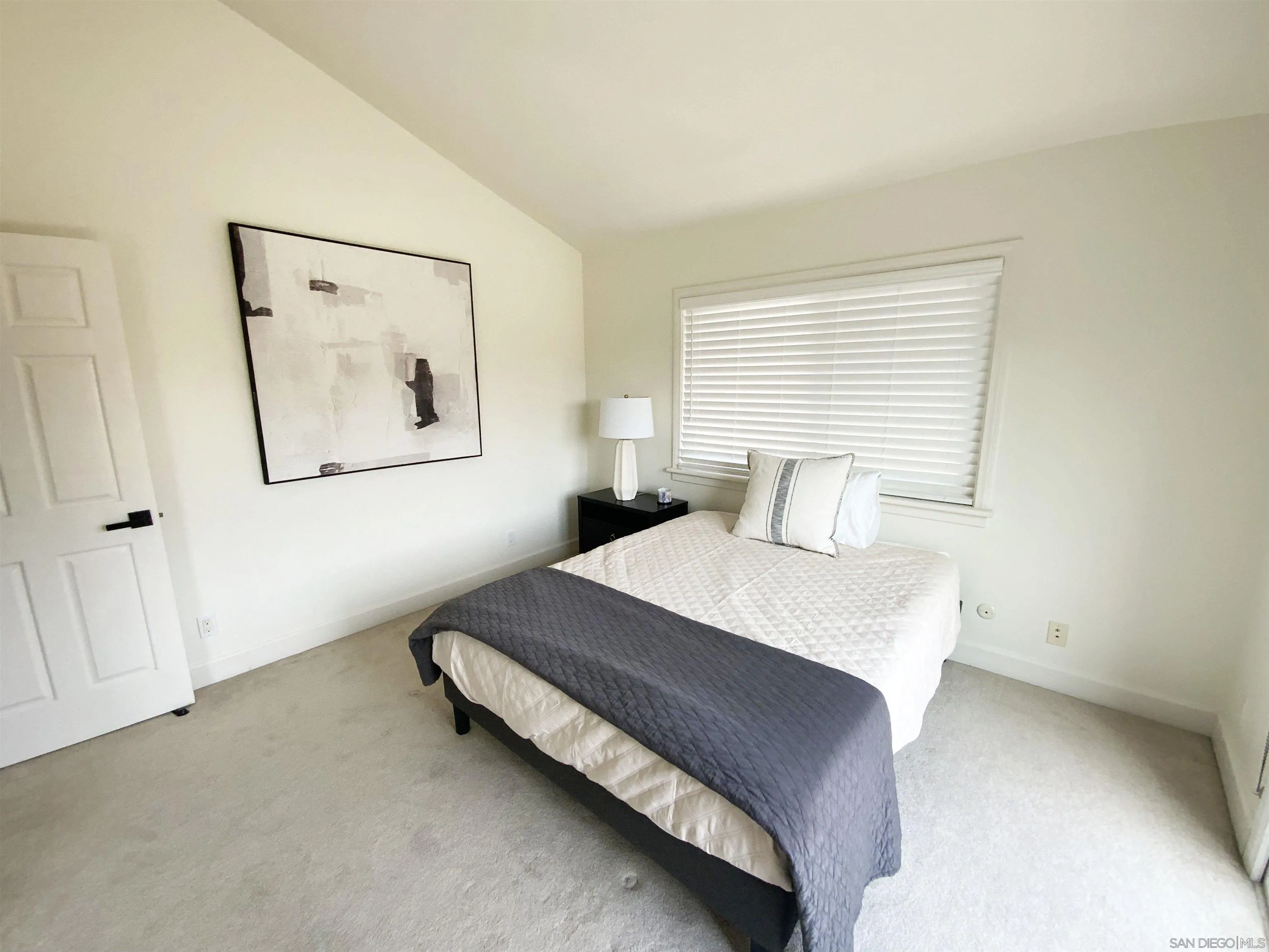 39 Green Turtle Road Coronado, CA 92118 - Photo 22 of 26 a bedroom with a bed and window
