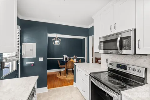 a kitchen with a stove and a microwave