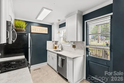a kitchen with a stove and a refrigerator