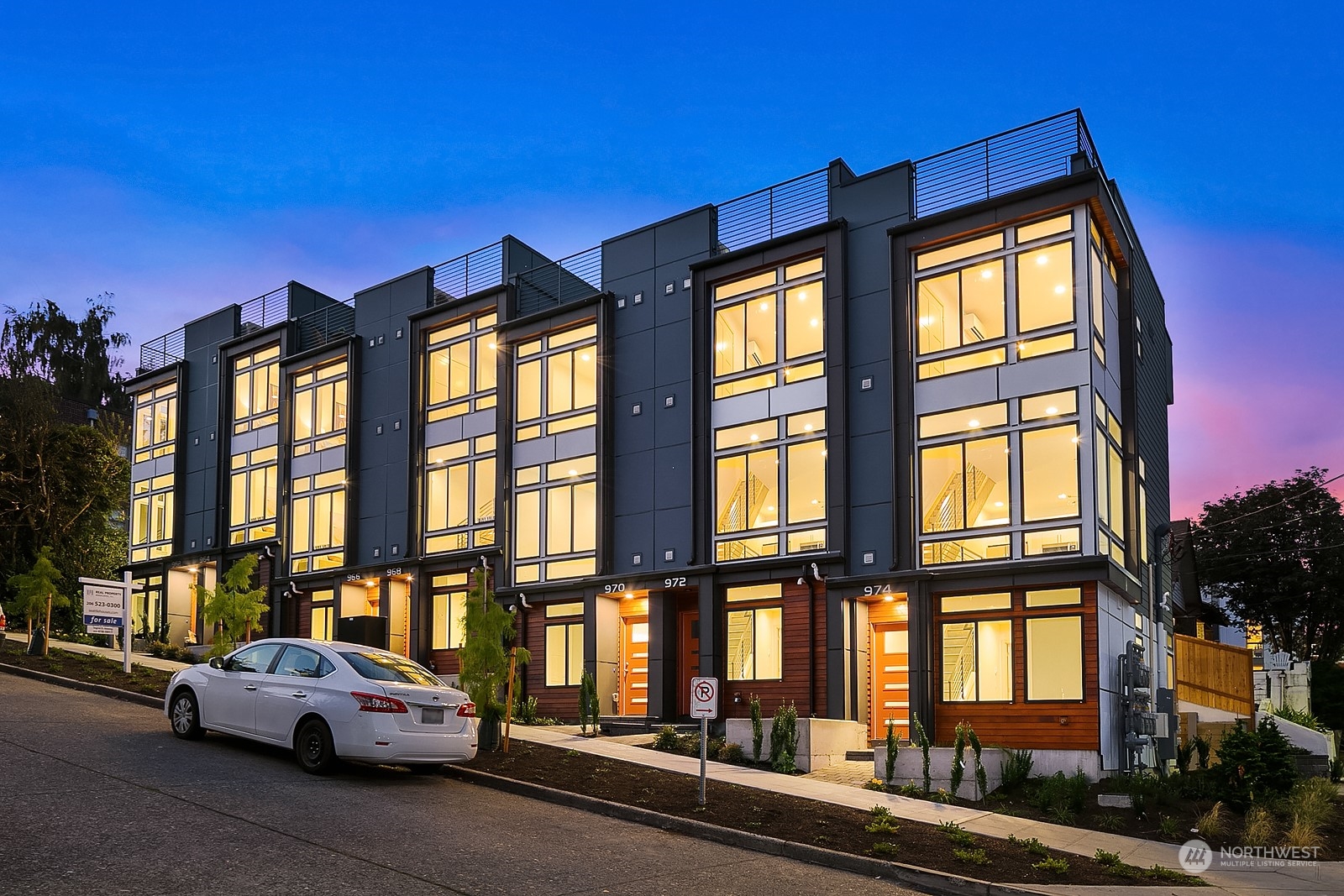 966 North Allen Place Seattle, WA 98103 - Photo 5 of 38 a view of building with car parked