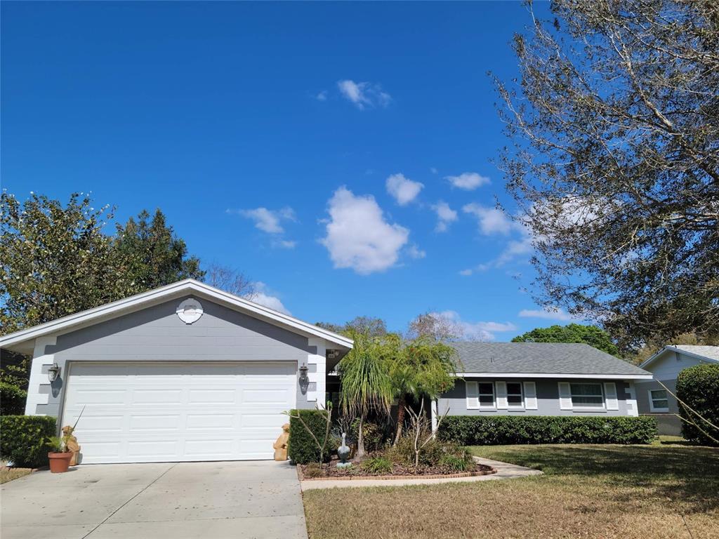 2739 Prince John Road Winter Park, FL 32792 - Photo 1 of 1 a front view of a house with a yard and garage