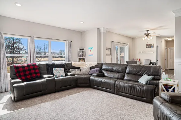 a living room with a couch and a window
