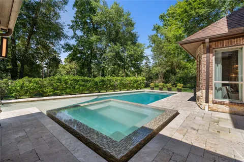 a view of a mini pool with a yard