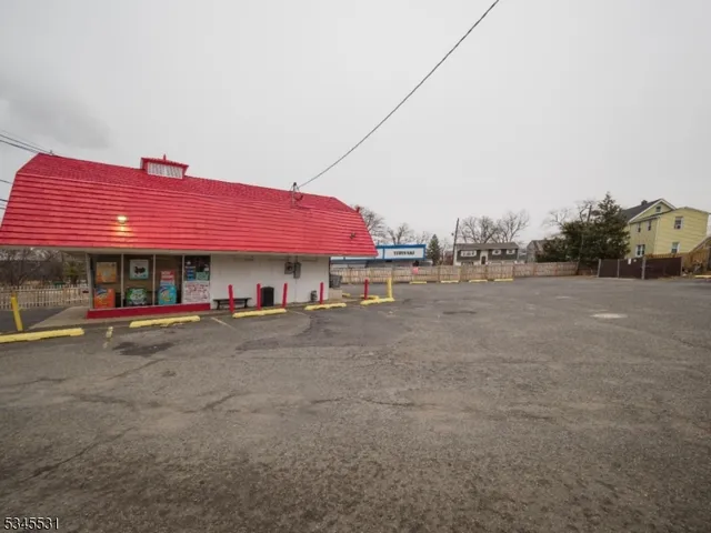 a front view of a house with small garden