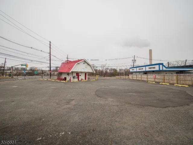 a view of patio with a table and chairs under an umbrella