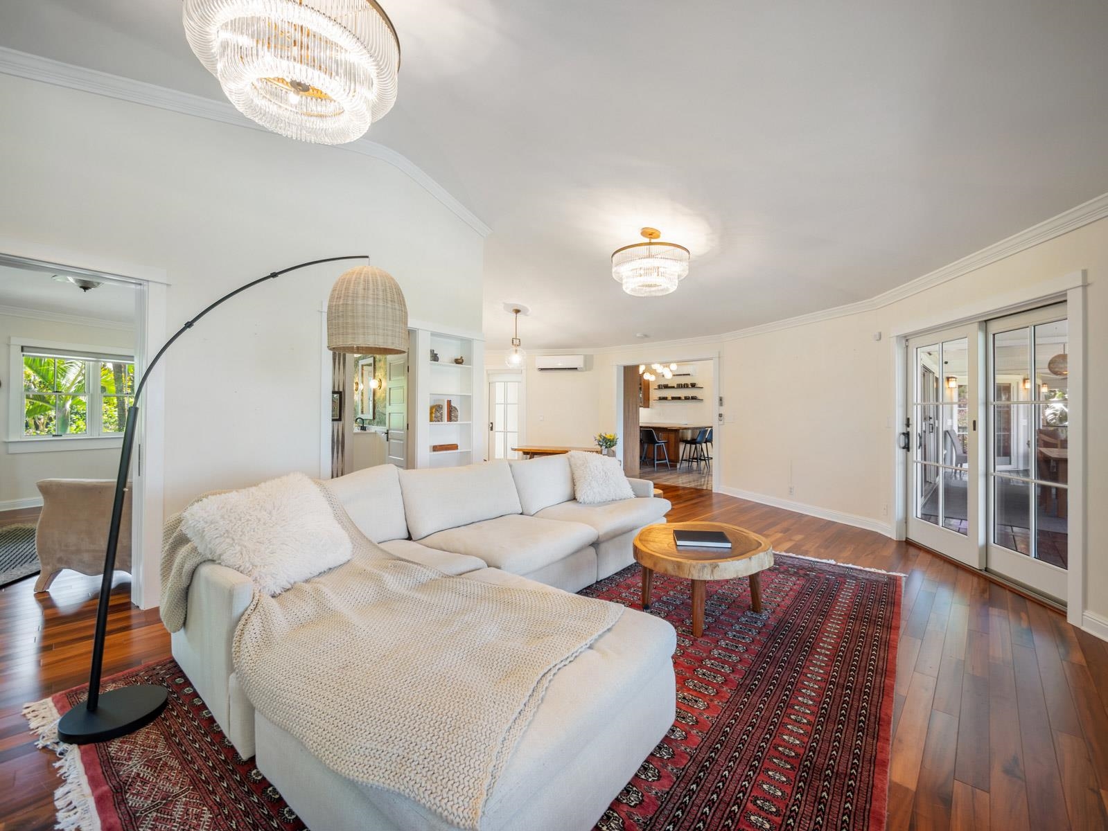 65 North Holokai Road Haiku, HI 96708 - Photo 41 of 50 a living room with fireplace furniture and a wooden floor