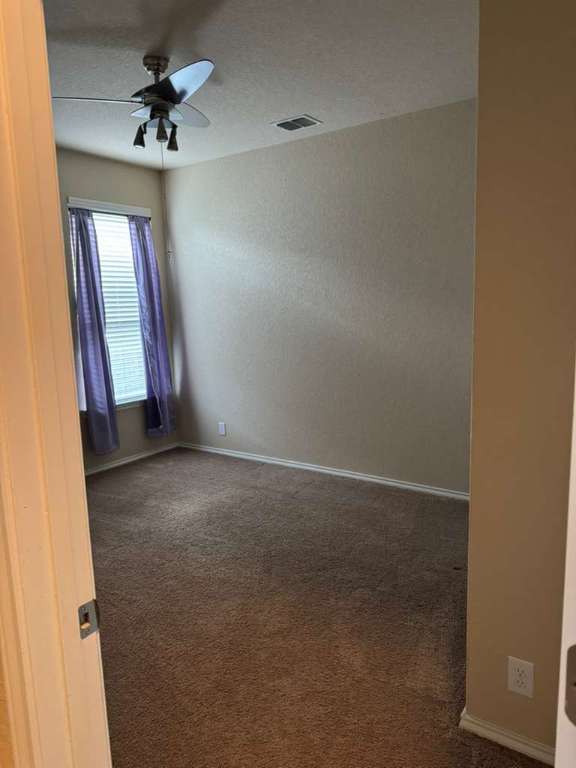 9626 Common Law Converse, TX 78109 - Photo 21 of 31 an empty room with windows and fan