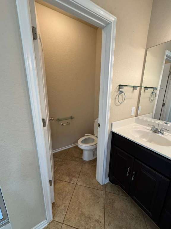 9626 Common Law Converse, TX 78109 - Photo 8 of 31 a bathroom with a sink a toilet a shower and a window