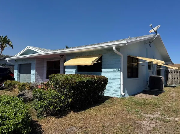 a front view of a house with a garage
