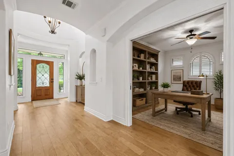 a view of a livingroom with furniture and wooden floor