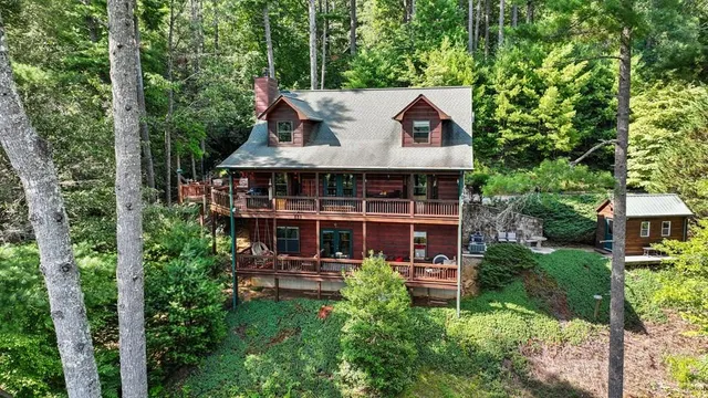 a aerial view of a house with pool table and chairs