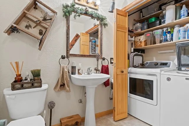 a reading room with furniture and a chandelier