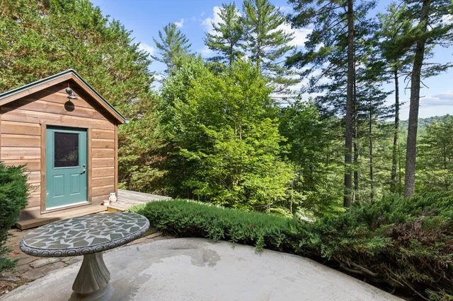 a view of a wooden balcony and a window
