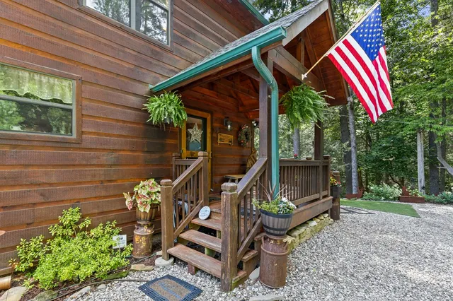 a view of a patio with couches table and chairs and potted plants