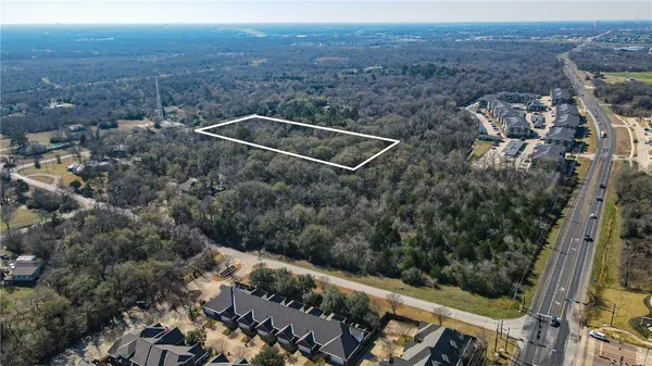 an aerial view of house with yard
