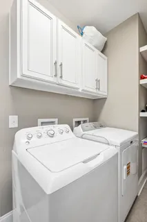 a bedroom with a large bed closet and a window
