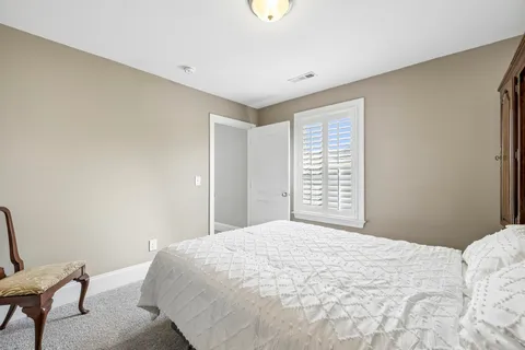 a bedroom with furniture and a couch