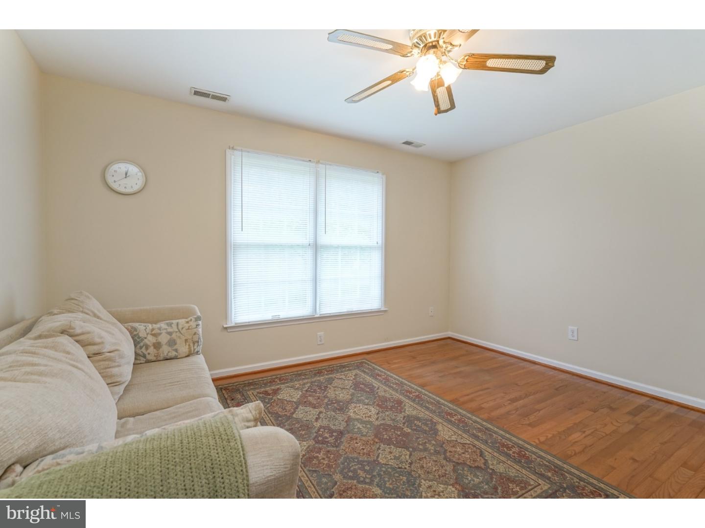 38 Stanwyck Road Mount Laurel, NJ 08054 - Photo 20 of 25 a bedroom with a bed and a chandelier fan