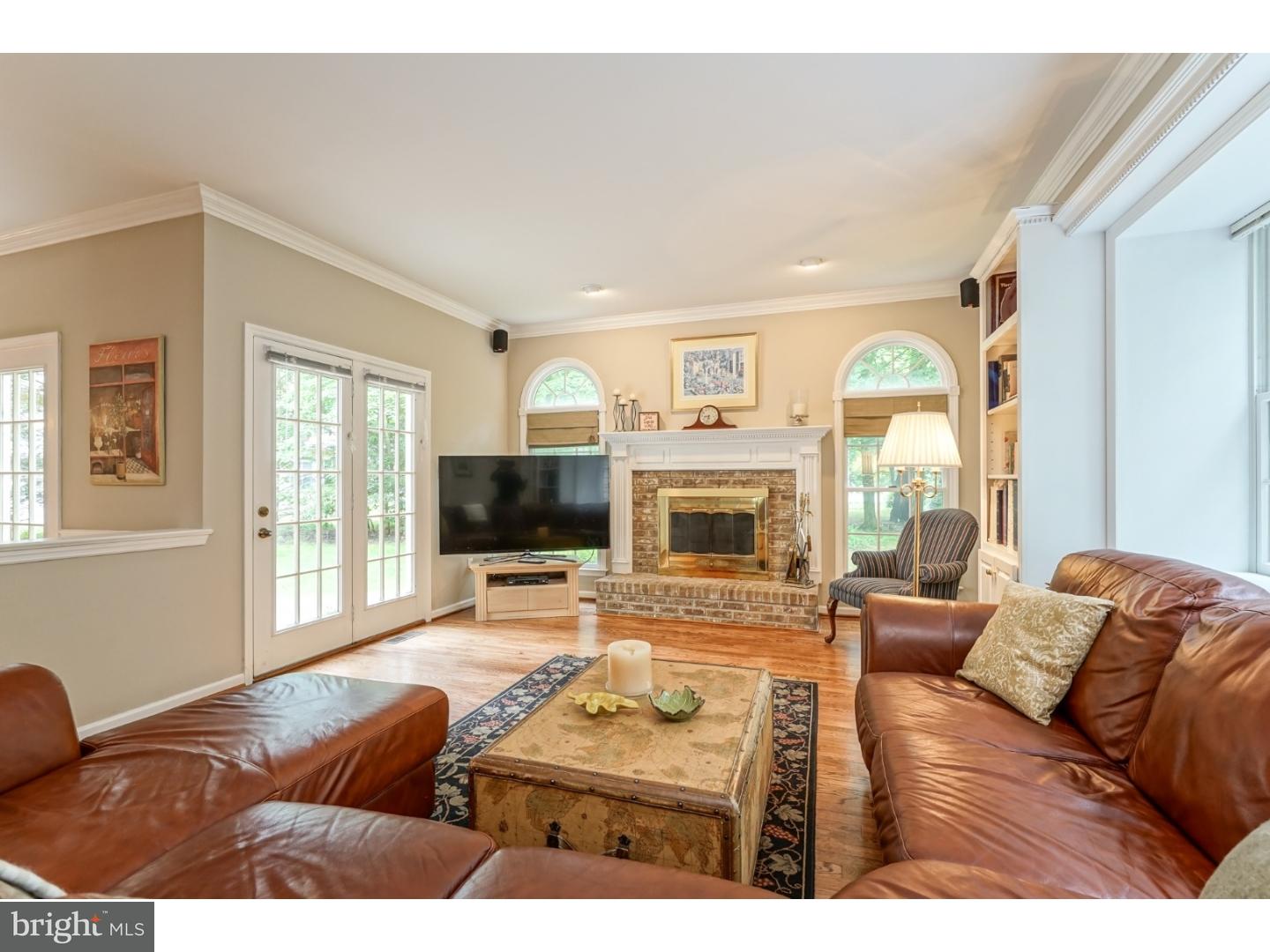 38 Stanwyck Road Mount Laurel, NJ 08054 - Photo 8 of 25 a living room with furniture a flat screen tv and a fireplace