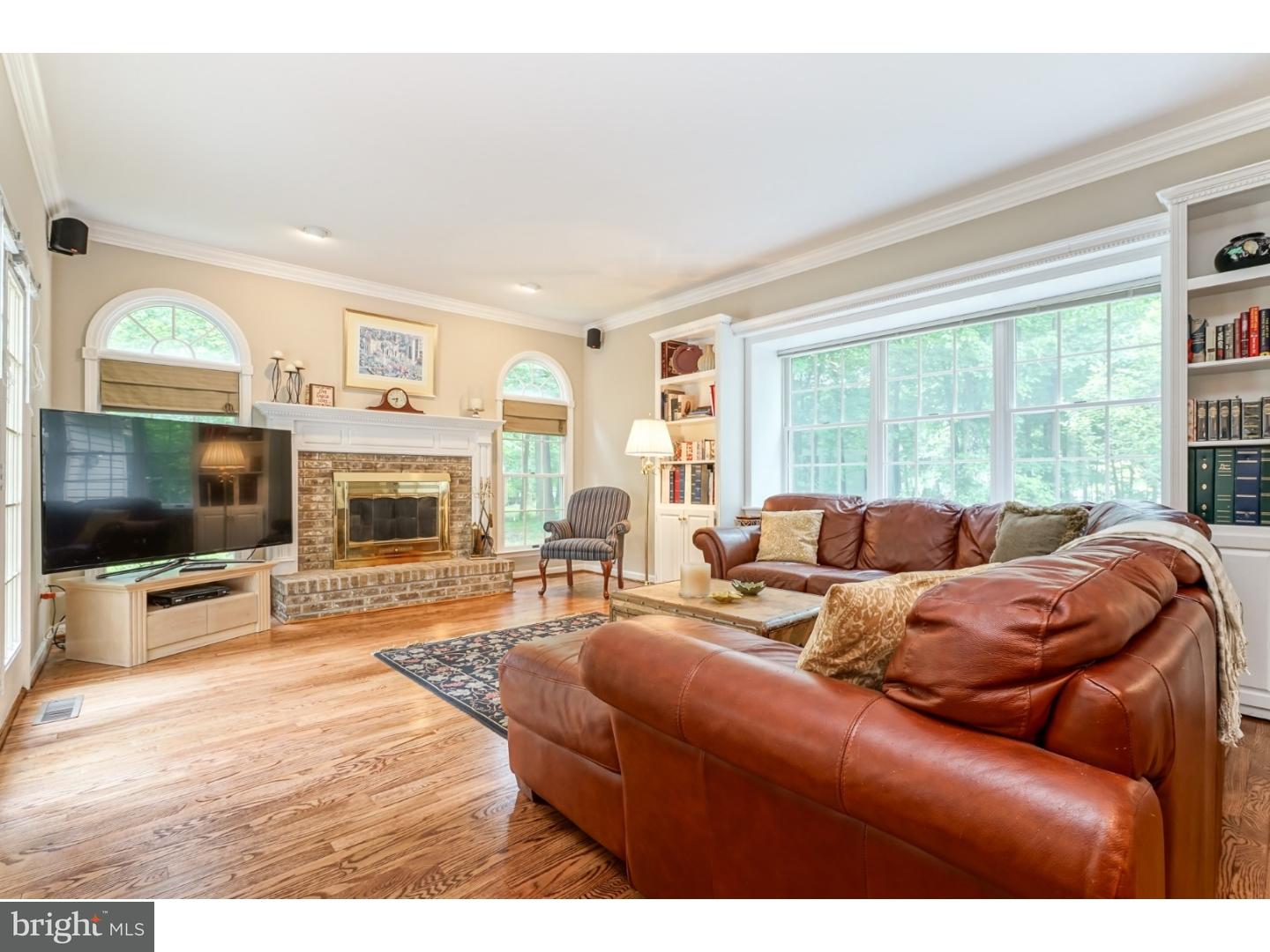 38 Stanwyck Road Mount Laurel, NJ 08054 - Photo 9 of 25 a living room with furniture a flat screen tv and a fireplace