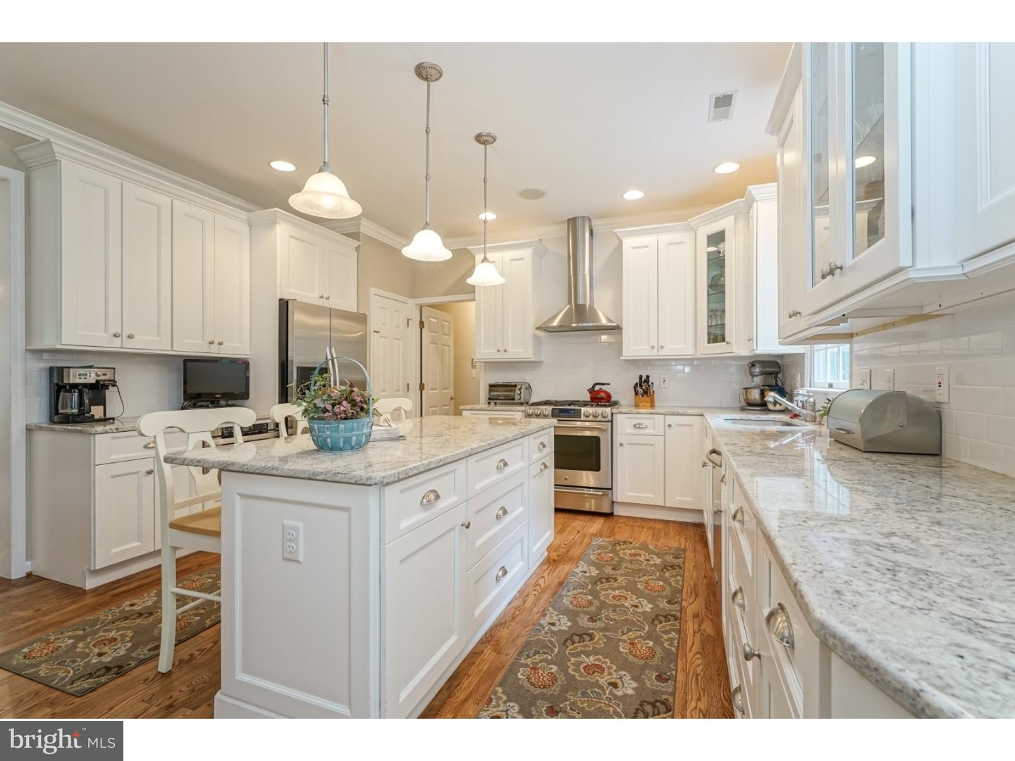 38 Stanwyck Road Mount Laurel, NJ 08054 - Photo 10 of 25 a kitchen with kitchen island granite countertop a sink cabinets and stainless steel appliances