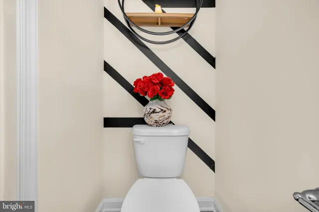 a bathroom with a toilet and a vanity