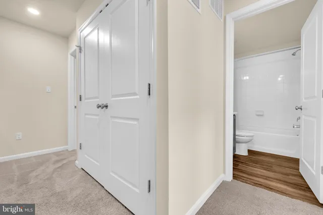 a bathroom with white walls