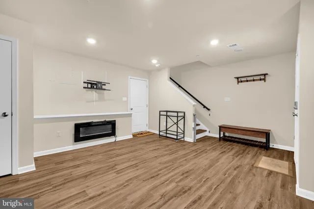 a view of livingroom with hardwood floor and a fireplace