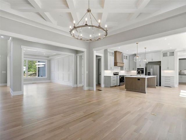 a kitchen with a sink stove and microwave