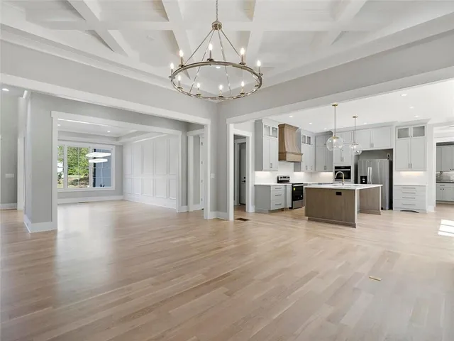 a kitchen with a sink stove and microwave