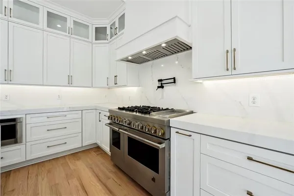 a kitchen with a sink and a stove