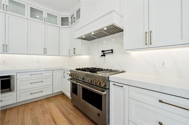 a kitchen with a sink and a stove