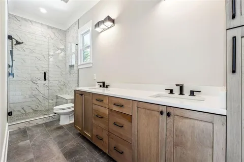 a bathroom with a bathtub and shower