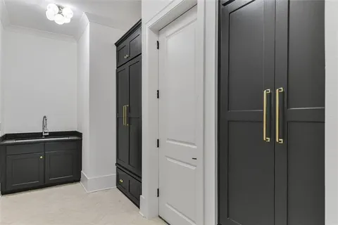 a spacious bathroom with a double vanity sink and mirror