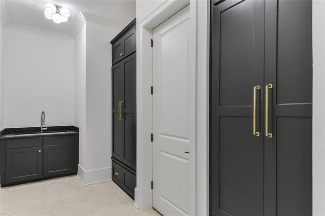 a spacious bathroom with a double vanity sink and mirror