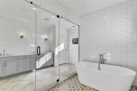 a bathroom with a toilet sink and shower