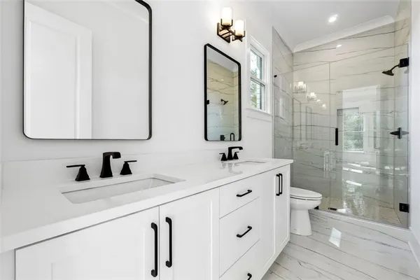 a close view of a sink and dishwasher in kitchen with dishwasher