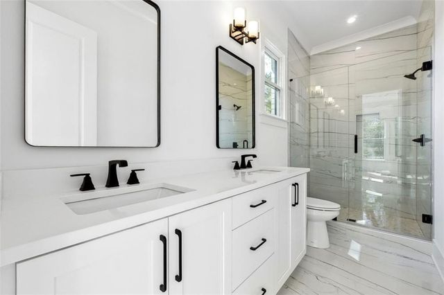 a close view of a sink and dishwasher in kitchen with dishwasher