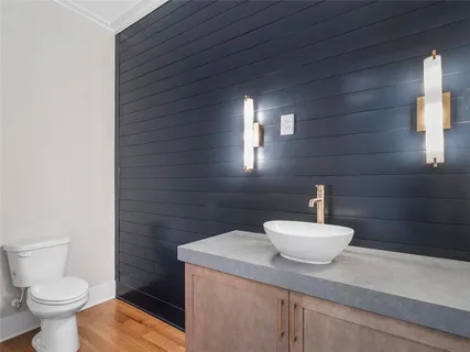 a kitchen with stainless steel appliances a sink and cabinets