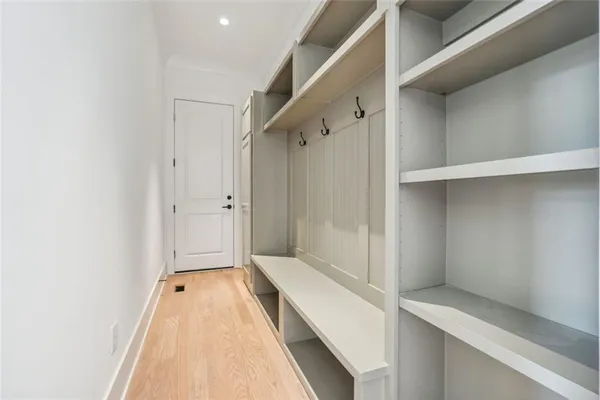 a view of wooden floor and windows in a room