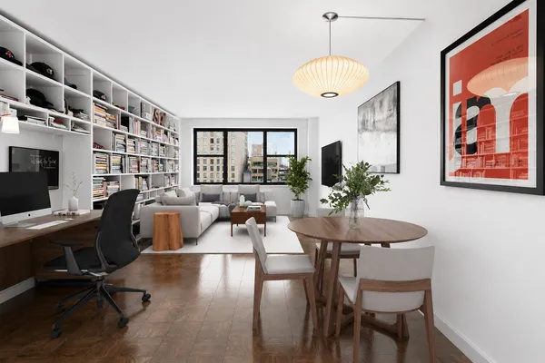 a view of a dining room with furniture window and wooden floor