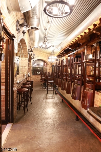 237 Haledon Avenue Haledon, NJ 07508 - Photo 7 of 33 a view of a patio with a table and chairs
